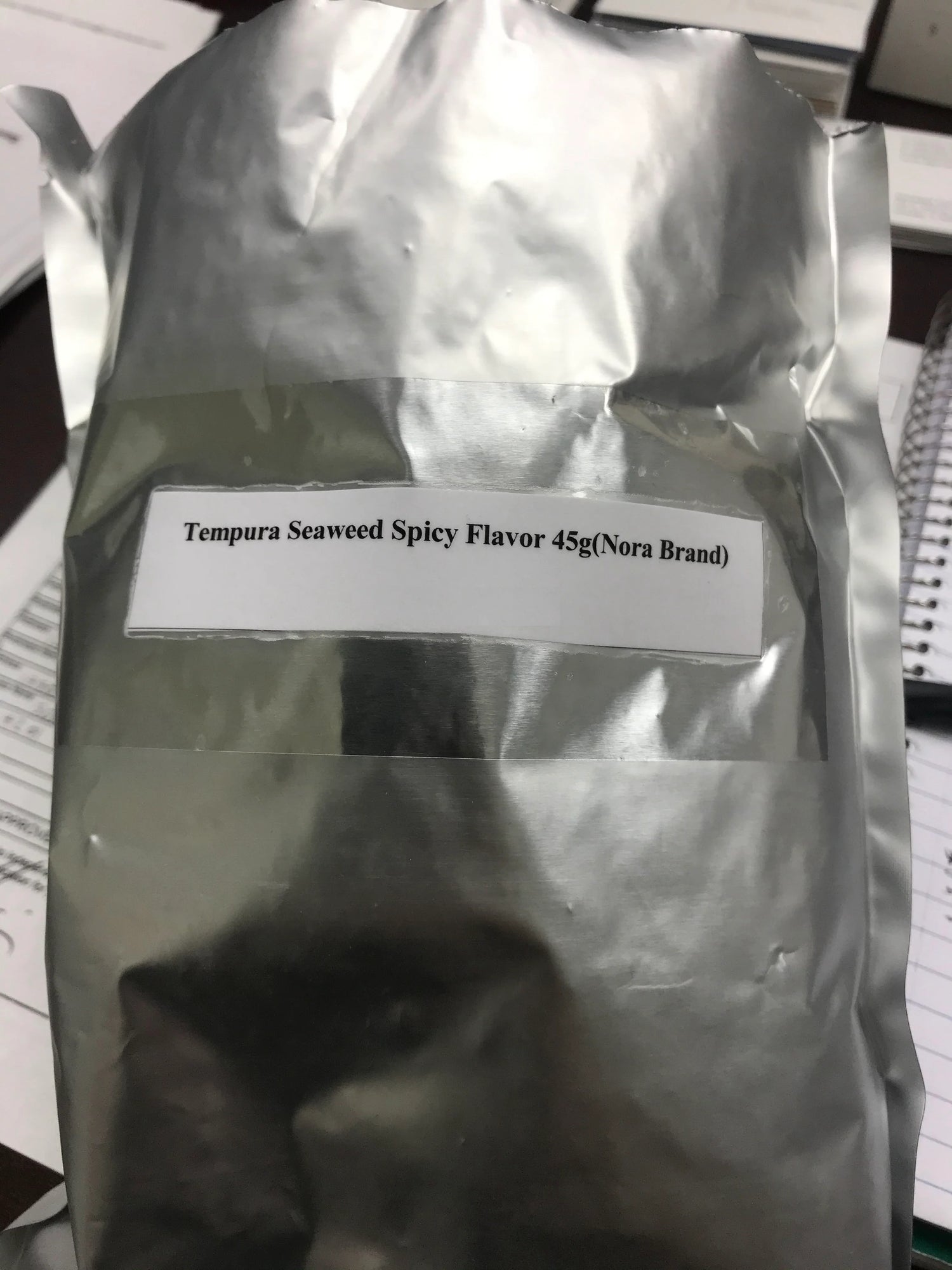 A bag of Tempura Seaweed Spicy Flavor 45g 