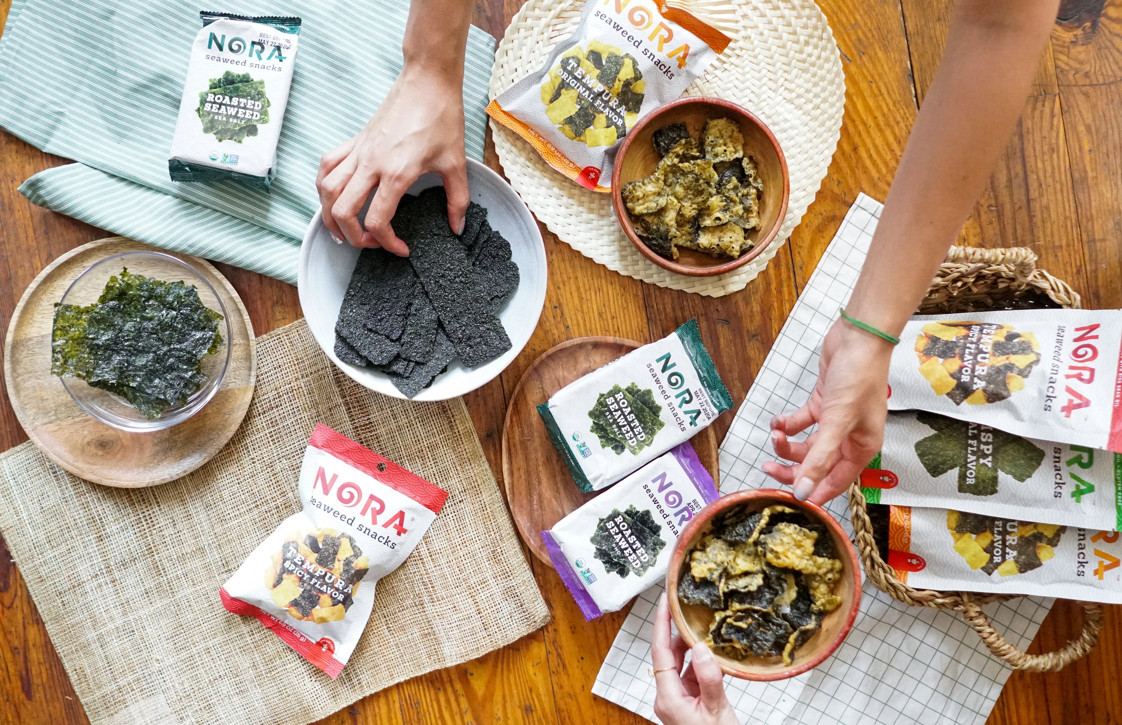 Variety of Nora Seaweed Snacks displayed out on a table